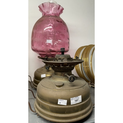 197 - Lighting: 19th cent. Veritas brass oil lamp room heater with large cranberry glass shade and funnel,... 