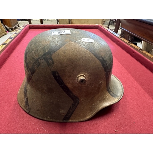 228 - Militaria: German infantry helmet with later paint together with zinc water bottle.