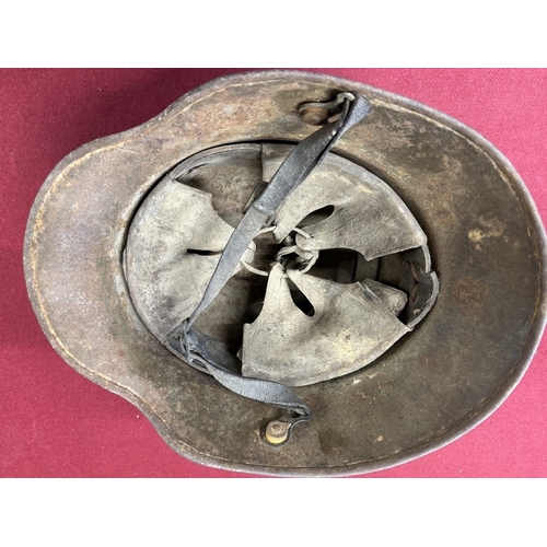 228 - Militaria: German infantry helmet with later paint together with zinc water bottle.