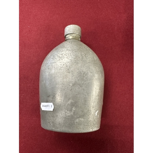 228 - Militaria: German infantry helmet with later paint together with zinc water bottle.