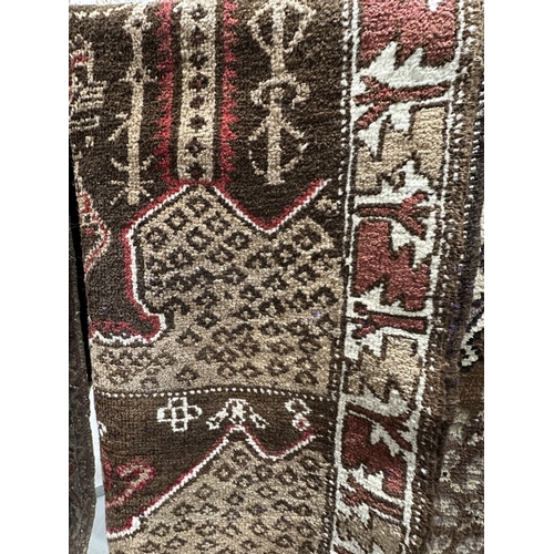 39 - Carpets & Rugs: Islamic prayer rug red ground woven with the Tree of Life stylised geometric pattern... 