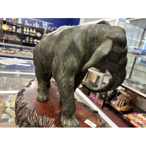 437 - Chinese: Patinated hollow cast bronze elephant with Zhuanshu mark to the underside 39cm. Together wi... 