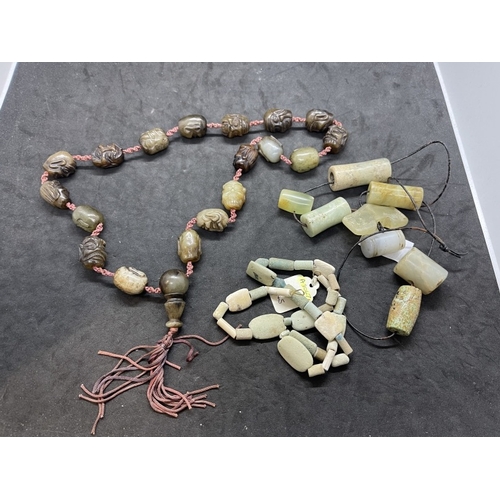 445 - Jewellery: 19th cent. Chinese jade or jadeite court necklace each bead carved as a male head, togeth... 