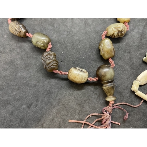 445 - Jewellery: 19th cent. Chinese jade or jadeite court necklace each bead carved as a male head, togeth... 