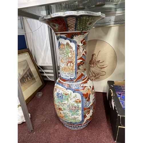 447 - Ceramics: 19th cent. Imari floor vase bulbous base, slim neck and flared rim with birds, floral pane... 