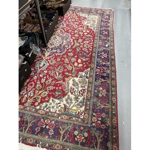 52 - Carpets & Rugs: Iranian Tabriz rug red ground with a central floral medallion, ivory spandrels with ... 