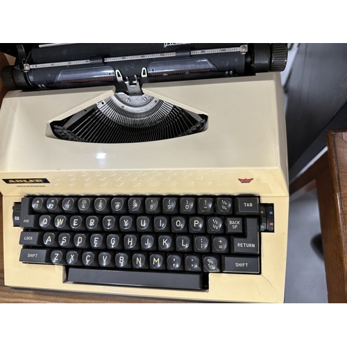 63 - Typewriters: 20th cent. Olivetti Lettiera 32 gunmetal/teal blue in original case, paperwork dated Ma... 