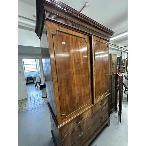 66 - Furniture: Georgian flame mahogany wardrobe on chest, two panelled doors enclosing hanging space, ab... 