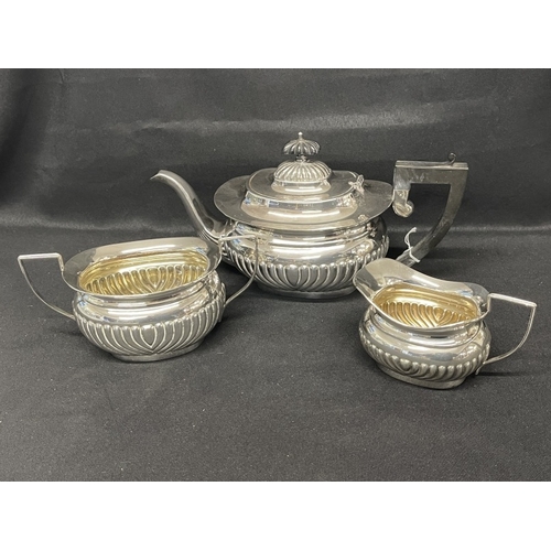 672 - Electro Plate: Electro Plate: Reeded Regency style teapot, creamer and sucre. Teapot with ebony hand... 