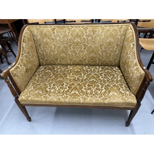 72 - Furniture: Edwardian Sheraton Revival satinwood/beech two-seater sofa with padded back and sides and... 