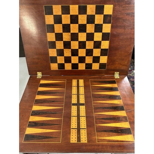 94 - Edwardian Mahogany Games Table Edwardian Regency Revival mahogany games and work table, top opens to... 