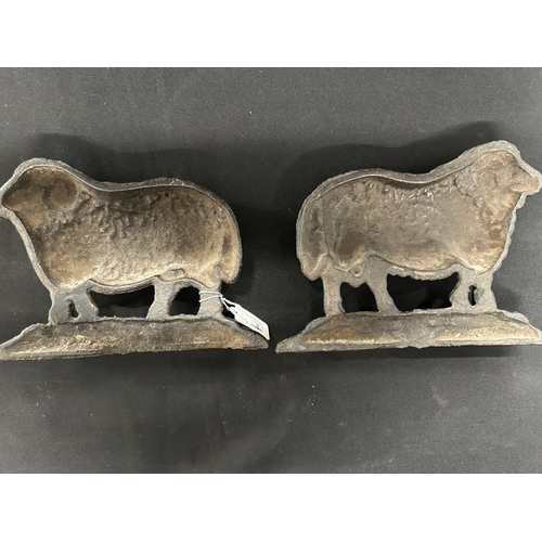 383 - Metalware: 19th cent. Cast iron decorative ram doorstops, a pair.