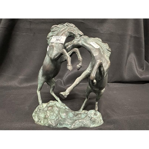 386 - Bronze: 20th cent. Hollow cast brass rearing horses. 30cm high.