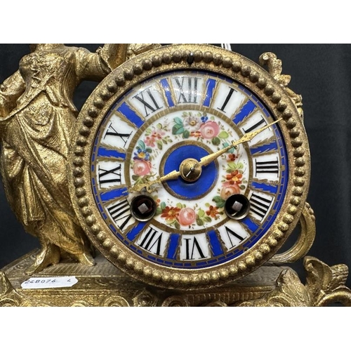 398 - Clocks: Clocks: Late 19th cent. gilt spelter mantel clock modelled as a peasant flower girl standing... 