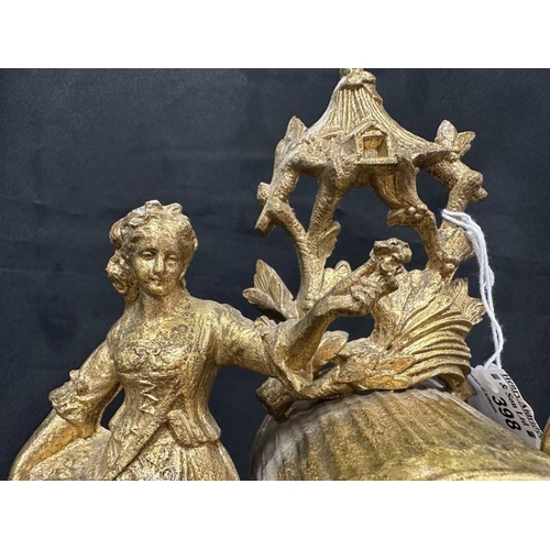 398 - Clocks: Clocks: Late 19th cent. gilt spelter mantel clock modelled as a peasant flower girl standing... 