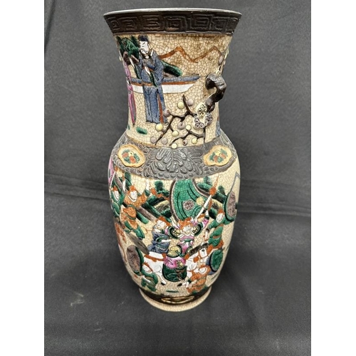 429 - Ceramics: Early 20th cent. Chinese crackleware vase profusely enamelled with a battle scene. 40cm.... 