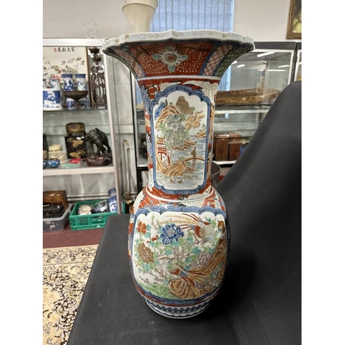 448 - Ceramics: 19th cent. Imari floor vase bulbous base, slim neck and flared rim with birds, floral pane... 