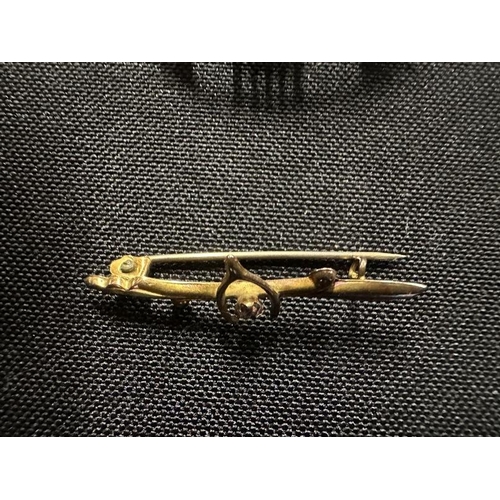 460 - Jewellery: 9ct gold wishbone bar brooch together with a marcasite set silver and enamel brooch model... 