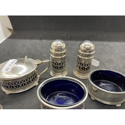 534 - Hallmarked Silver: Condiment set with blue glass liners, various hallmarks. Net weight 6.02oz.... 