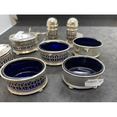 534 - Hallmarked Silver: Condiment set with blue glass liners, various hallmarks. Net weight 6.02oz.... 