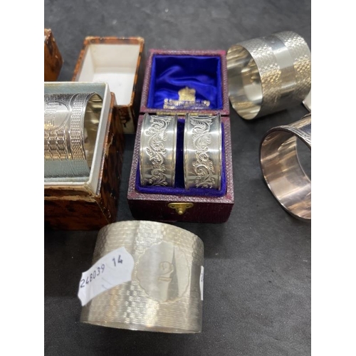 538 - Hallmarked Silver: Nine napkin rings, various patterns and hallmarks. Weight 7.8oz.