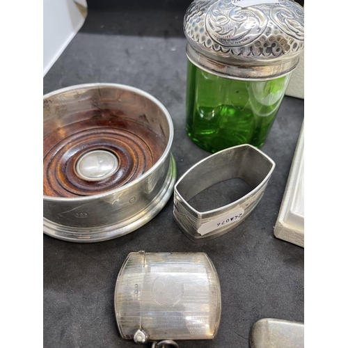 550 - Hallmarked Silver: Bottle coaster, eggcup and spoon, Vesta case, napkin ring, odd spoons, part of dr... 