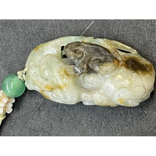 636 - Jewellery: Chinese variegated jade pendant carved with lingzhi fungus on bamboo, 5cm. Together with ... 