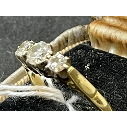 637 - Hallmarked Jewellery: 18ct yellow gold three stone diamond ring, total diamond weight 0.6ct.... 