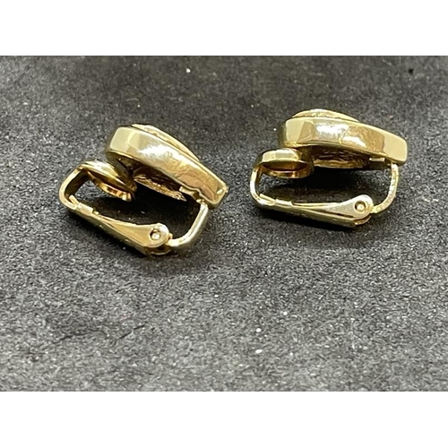 640 - Christian Dior: Teardrop shaped gilt metal clip on earrings set with green and white paste, a pair, ... 