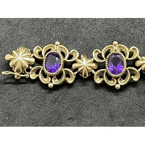 641 - Jewellery: 9ct gold rococo-style bracelet set with amethyst. 20.3cm. Gross weight 32g.