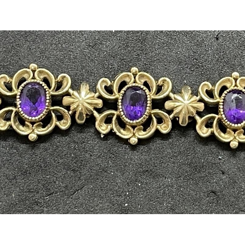 641 - Jewellery: 9ct gold rococo-style bracelet set with amethyst. 20.3cm. Gross weight 32g.