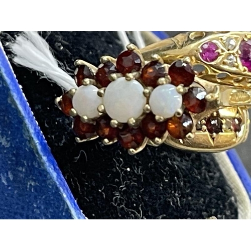 665 - Jewellery: 9ct yellow gold ring set with three opals within a frame of twelve garnets, 3.1g, and two... 