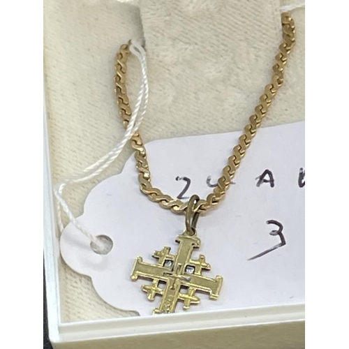 666 - Jewellery: Yellow metal Jerusalem cross, tests as 14ct gold, attached to an 18ins yellow metal S lin... 