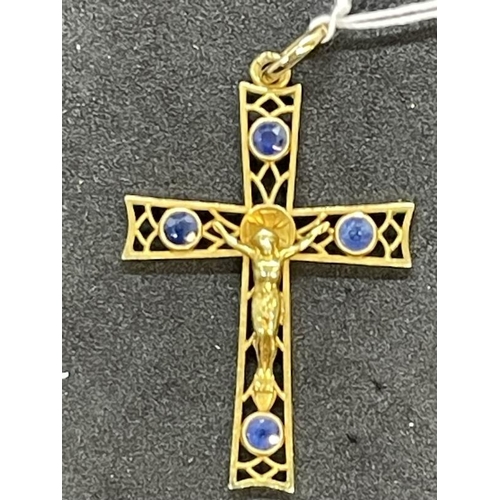 679 - Jewellery: Yellow metal pierced cross each bar set with a single sapphire, estimated weight of (4) 0... 