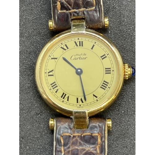 690 - Watches: Ladies Must de Cartier vermeil silver gilt cased watch with cabochon sapphire winder, in bo... 