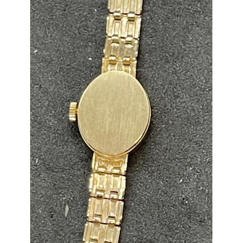 704 - Watches: Hallmarked 9ct gold ladies cocktail watch by Sovereign with integral gold strap. Gross weig... 