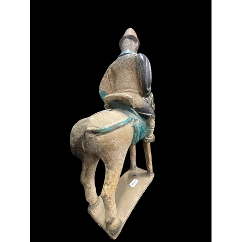 540 - Chinese: Chinese: Ming Period stoneware burial figure in the form of men on horseback in an aubergin... 