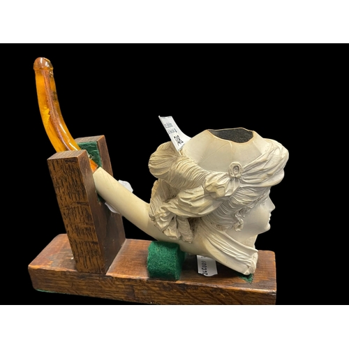 548 - Smoking Requisites: 19th cent. Meerschaum pipe with amber mouthpiece on stand. In very good overall ... 