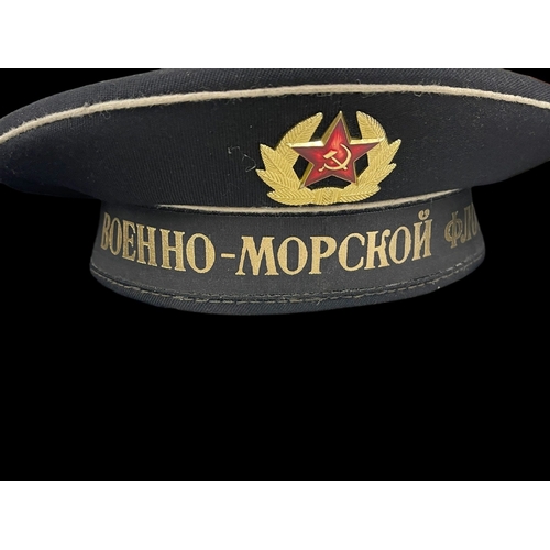 298 - Militaria: 20th cent. Russian fur hat, two different sailors' caps and submarine flag. (4)... 