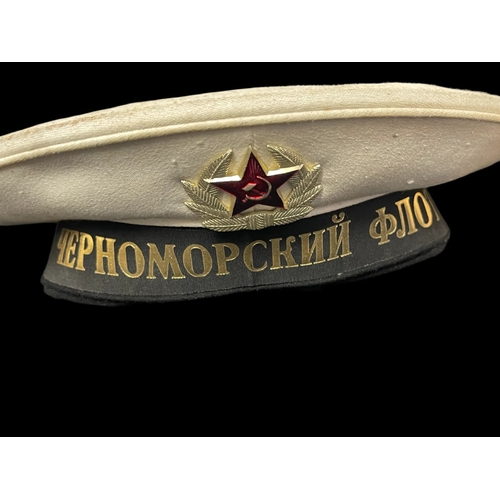 298 - Militaria: 20th cent. Russian fur hat, two different sailors' caps and submarine flag. (4)... 