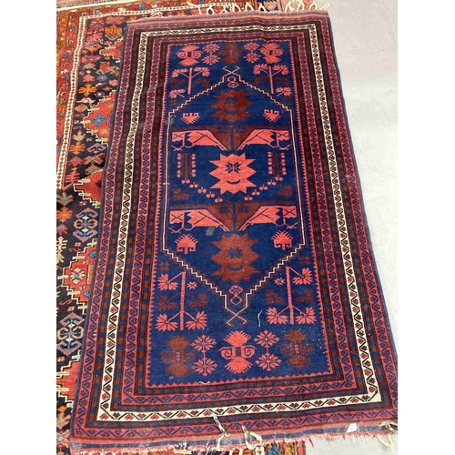 41 - Rugs: 20th cent. Anatolian/Turkish red/blue ground rug. 45ins. x 79ins.