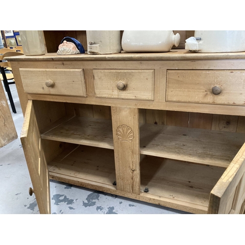 55 - Furniture: 20th cent. Pine dresser and rack the base three drawers over a twin door cupboard topped ... 