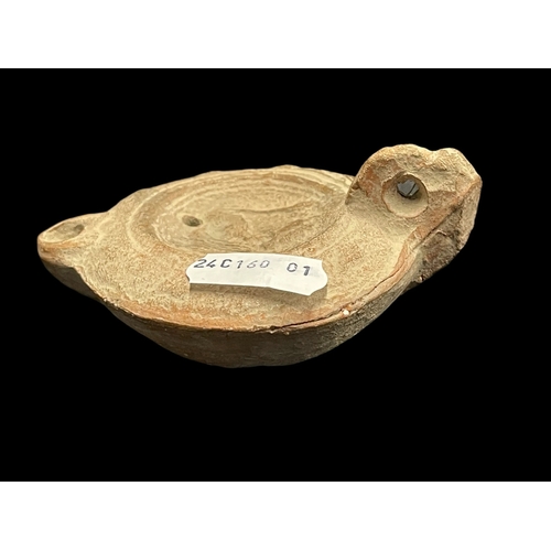 551 - Antiquities: Antiquities: Roman terracotta oil lamp with impressed figural decoration, 9cm. together... 