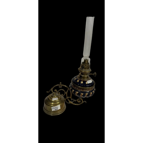 625 - Lamps: Weighted oil lamp with gadrooned pottery blue ground bowl, marked for Kaester & Tobleman.... 