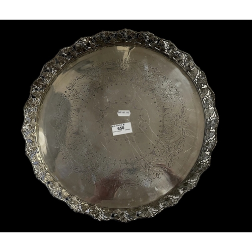 650 - Continental Silver: Round gallery tray with incised decoration and a rim cast with grapes and vine l... 