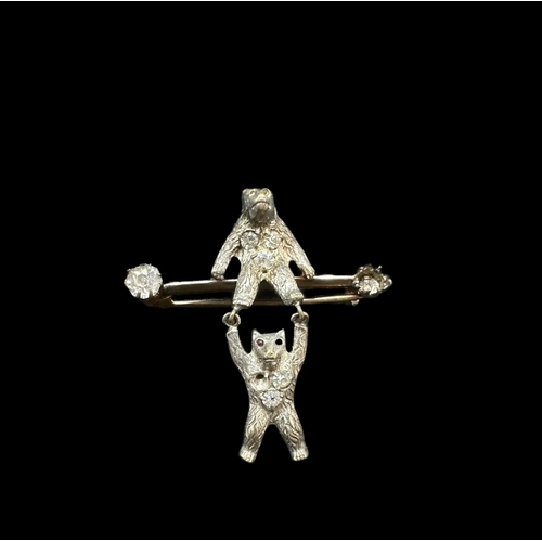 732 - Jewellery: White metal bar brooch modelled as two bears set with pastes, together with a Scottish st... 