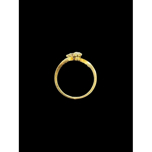 743 - Hallmarked Jewellery: 18ct yellow gold crossover style ring, three small diamonds to each side flank... 