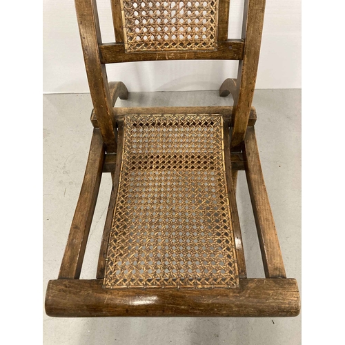 80 - Furniture: Early 20th cent. Child's rattan seat folding steamer chair.