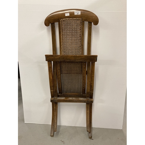 80 - Furniture: Early 20th cent. Child's rattan seat folding steamer chair.