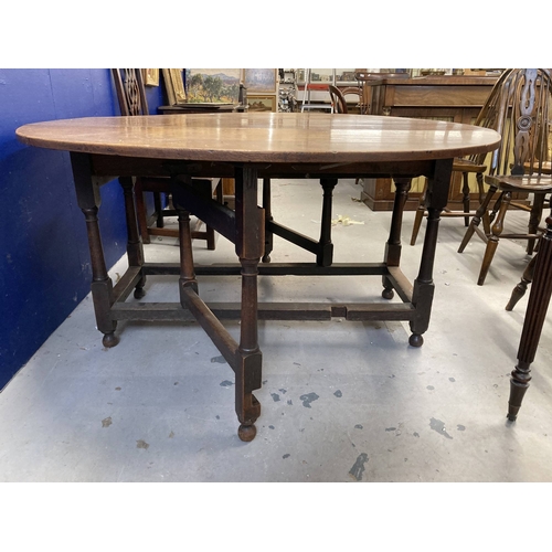 90 - Furniture: 18th cent. Oak gate leg table of good colour. 64ins. x 54½ins. Extended.